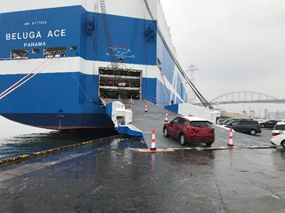 Car Carrier Vehicles loaded from a shore ramp